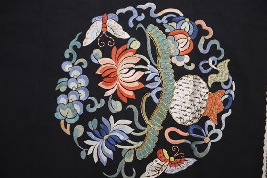 A Chinese embroidered black satin table frontal, late Qing dynasty, 211 x 56cm